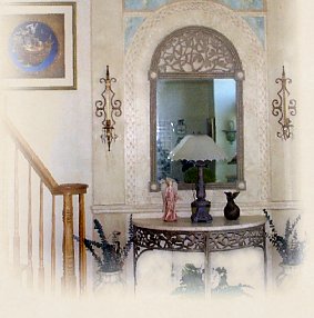 Stone Arch with several faux techniques and finishes -- dimensional faux stone, faux marble, trompe l'oeil, textured glazing and a hand-painted border