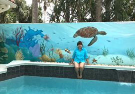 Original Coral Reef Mural on courtyard pool wall measuring 37' by 7'.